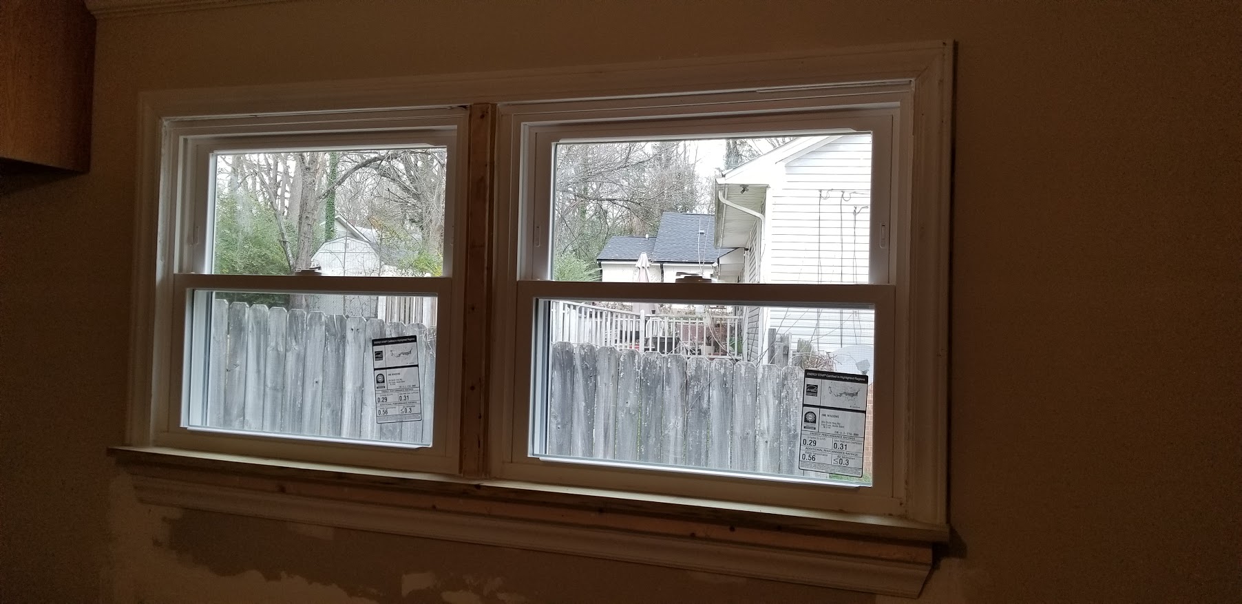 Old house window replacement with reused trim